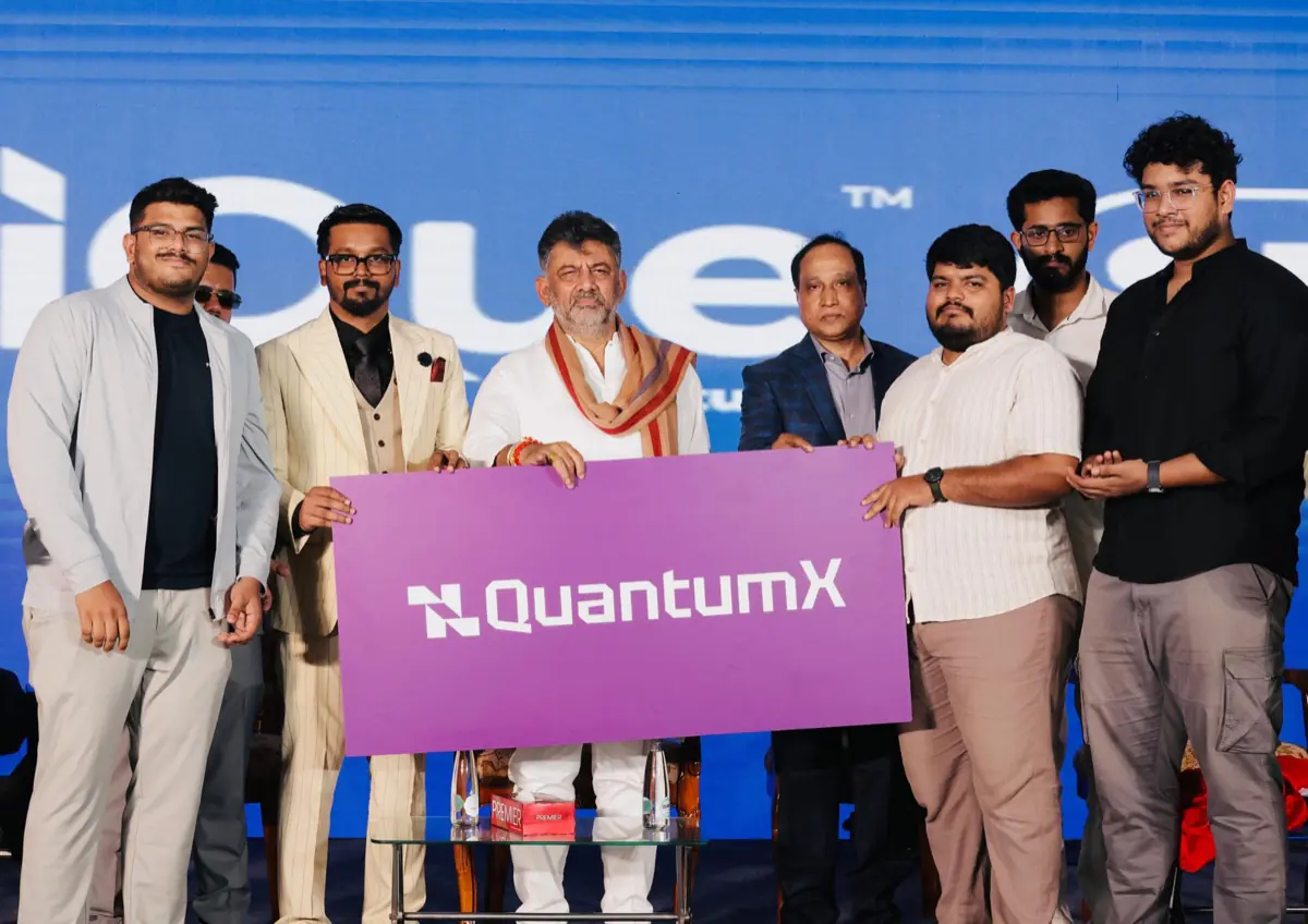 QuantumX launch – Ajmal and team with QuantumX banner